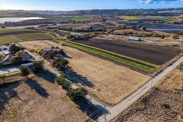 birds eye view of property featuring a rural view