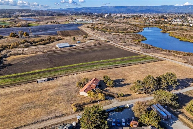 aerial view featuring a rural view and a water and mountain view