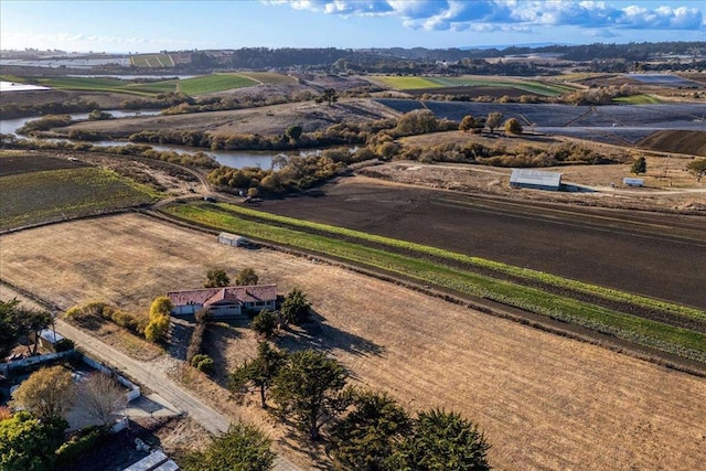 aerial view featuring a rural view and a water view