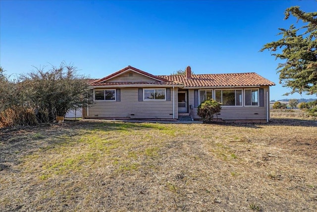 ranch-style home featuring a front yard