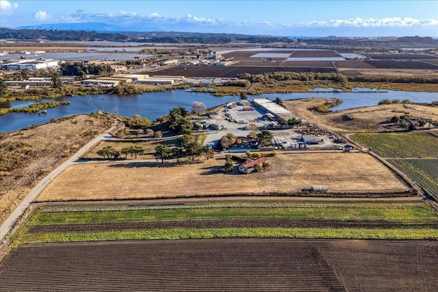 bird's eye view featuring a water view and a rural view