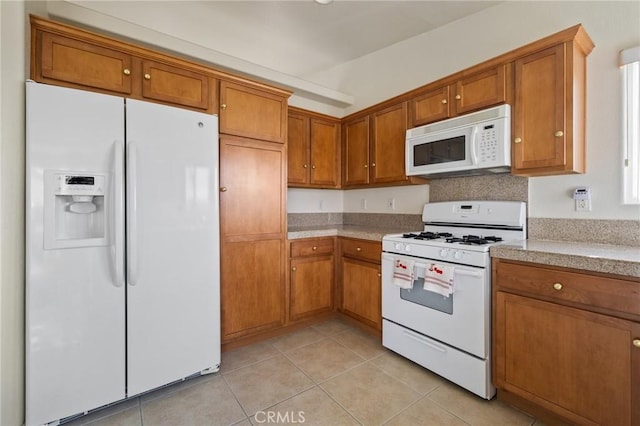 9551 San Rafael Dr, Desert Hot Springs, CA 92240 - kitchen featuring white appliances and light tile patterned floors