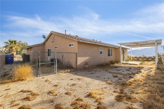 9551 San Rafael Dr, Desert Hot Springs, CA 92240 - view of home's exterior with a pergola