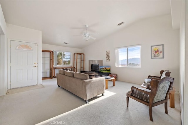 9551 San Rafael Dr, Desert Hot Springs, CA 92240 - living area with lofted ceiling, light carpet, and ceiling fan