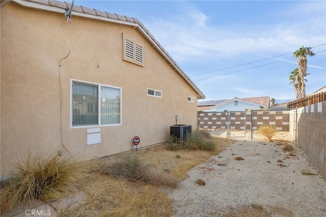 9551 San Rafael Dr, Desert Hot Springs, CA 92240 - view of property exterior featuring central AC unit