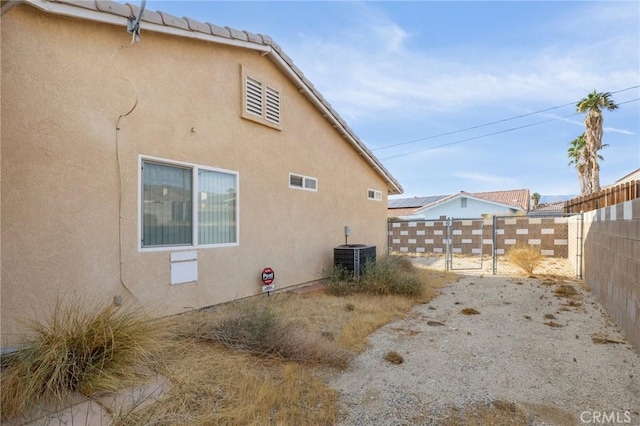 9551 San Rafael Dr, Desert Hot Springs, CA 92240 - view of property exterior with stucco siding and a fenced backyard