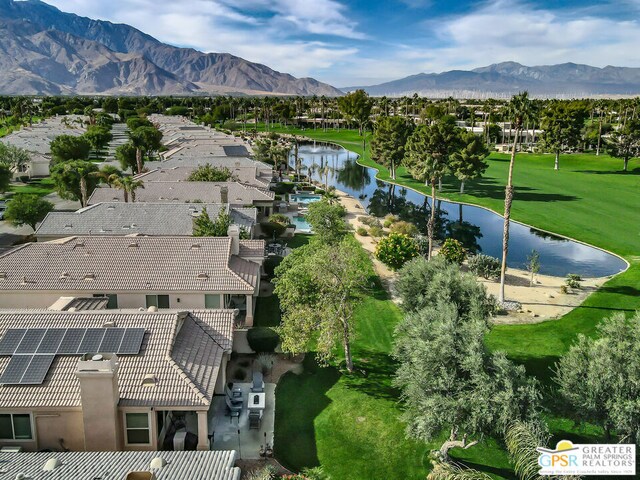 birds eye view of property featuring a water and mountain view