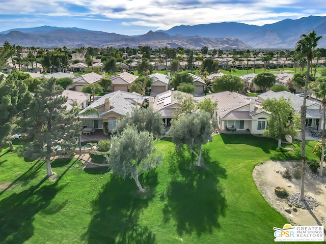 birds eye view of property featuring a mountain view