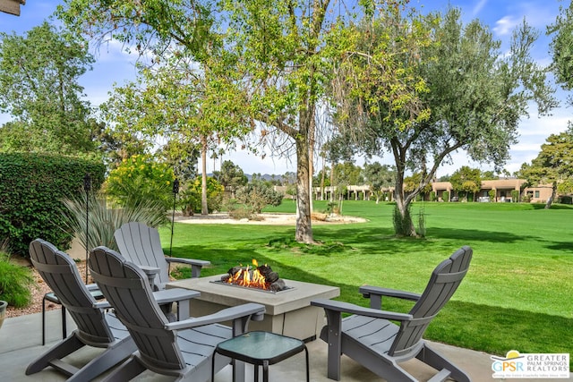 view of patio with an outdoor fire pit