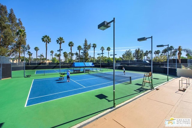 view of sport court featuring basketball hoop