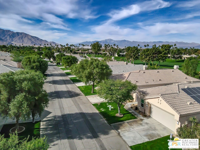 birds eye view of property featuring a mountain view