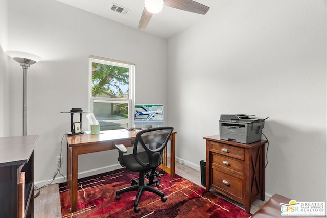 office space with ceiling fan and dark hardwood / wood-style flooring