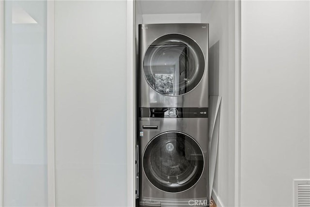 laundry room featuring stacked washer / dryer