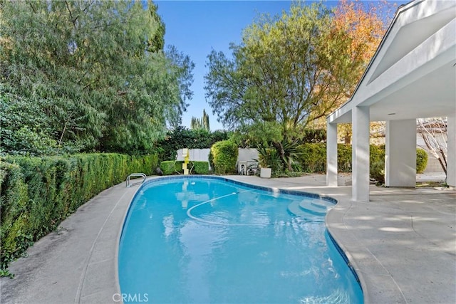 view of swimming pool featuring a patio area