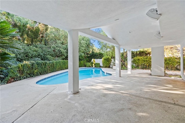 view of swimming pool featuring a patio