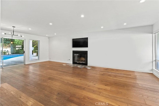 unfurnished living room featuring light hardwood / wood-style flooring