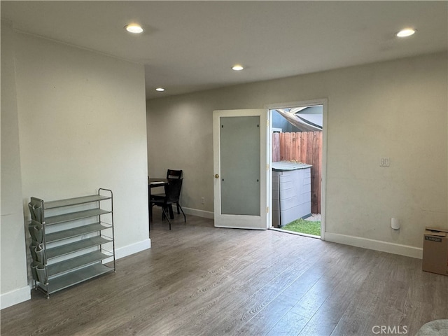 unfurnished room featuring dark hardwood / wood-style flooring