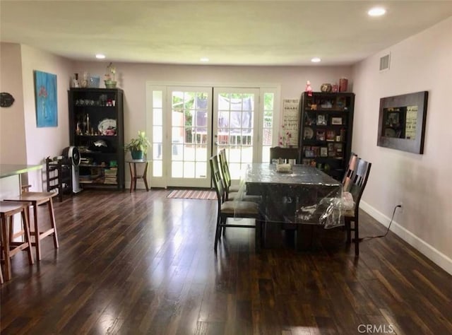 dining area with dark wood-type flooring