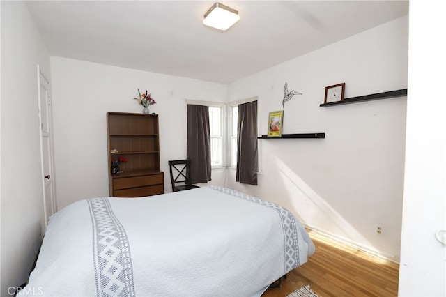 bedroom featuring hardwood / wood-style flooring