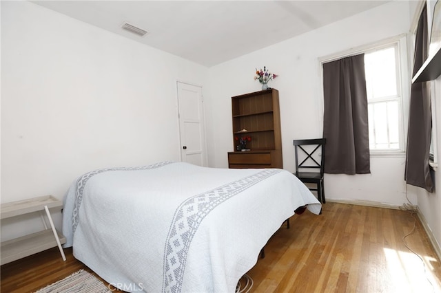 bedroom featuring hardwood / wood-style floors