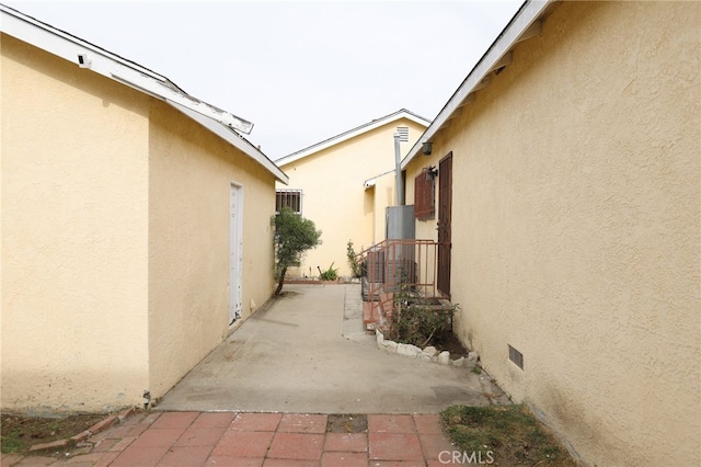 view of side of property featuring a patio area