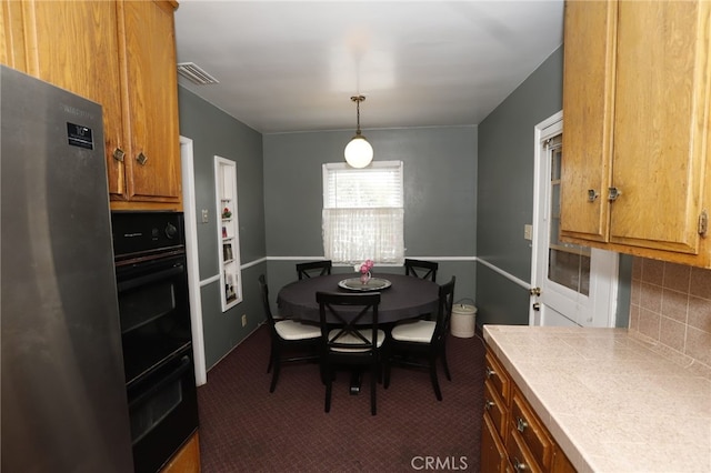 view of carpeted dining space