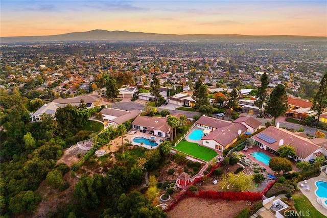 aerial view at dusk with a mountain view