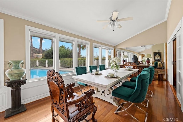 sunroom featuring a healthy amount of sunlight, lofted ceiling, and ceiling fan