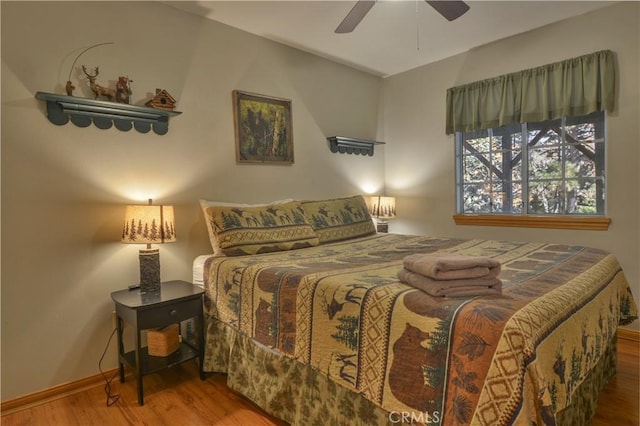 bedroom featuring hardwood / wood-style floors and ceiling fan