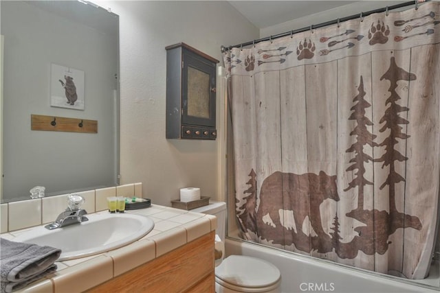 full bathroom featuring vanity, shower / bath combo, and toilet