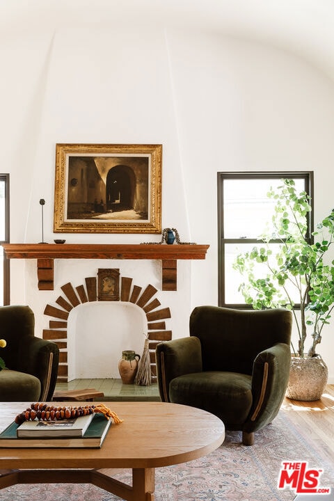 sitting room with hardwood / wood-style flooring