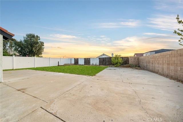 patio terrace at dusk with a lawn