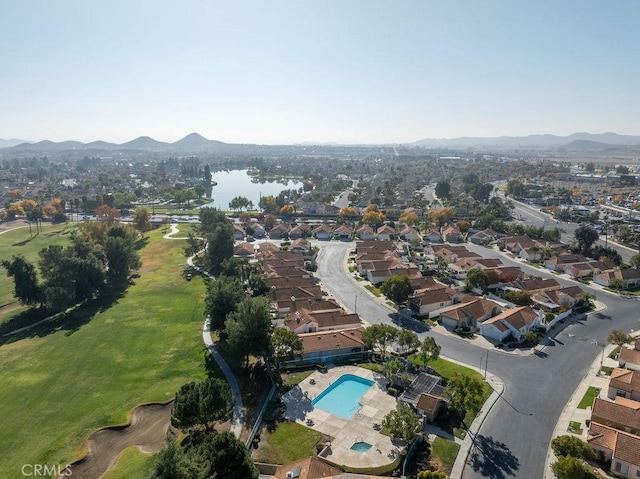 drone / aerial view featuring a residential view and a water and mountain view