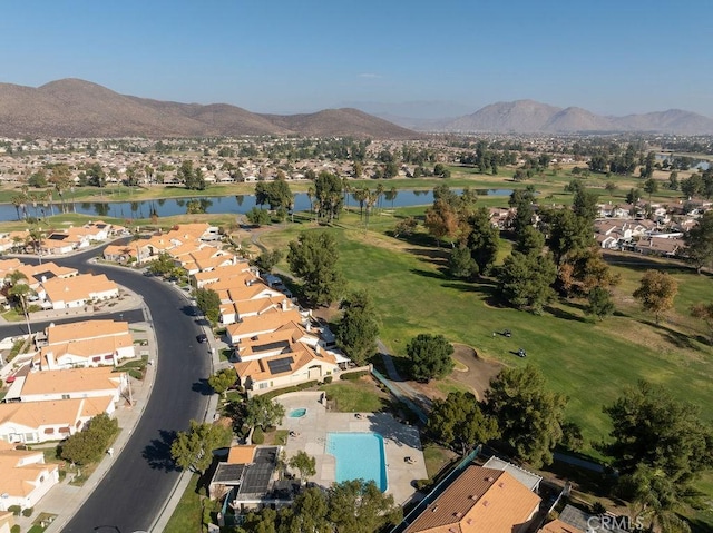 drone / aerial view with a residential view and a water and mountain view