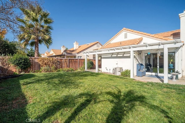 view of yard featuring a patio area, a pergola, and fence