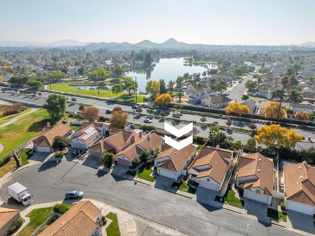 bird's eye view with a residential view and a water and mountain view