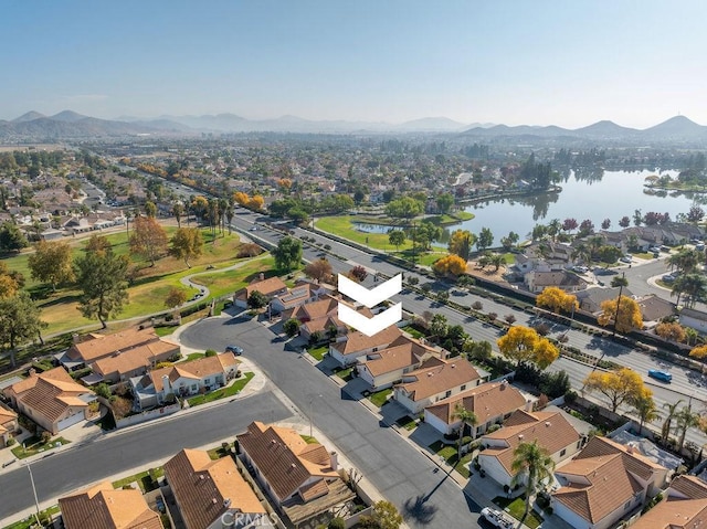 birds eye view of property with a residential view and a water and mountain view