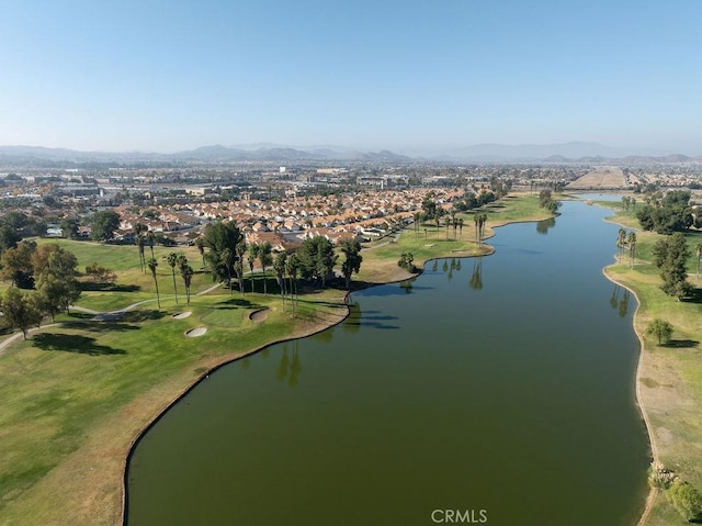 birds eye view of property with a water and mountain view