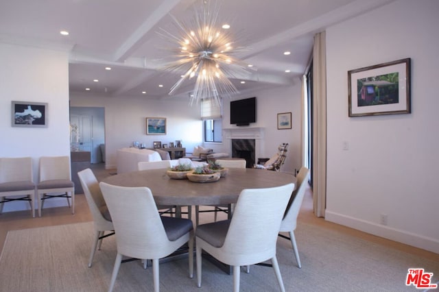 dining area with beamed ceiling and a notable chandelier