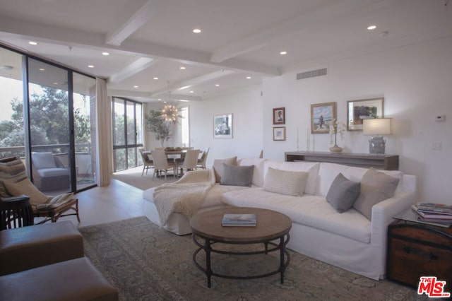 living room with expansive windows and beam ceiling