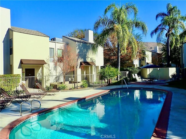 view of pool featuring a patio