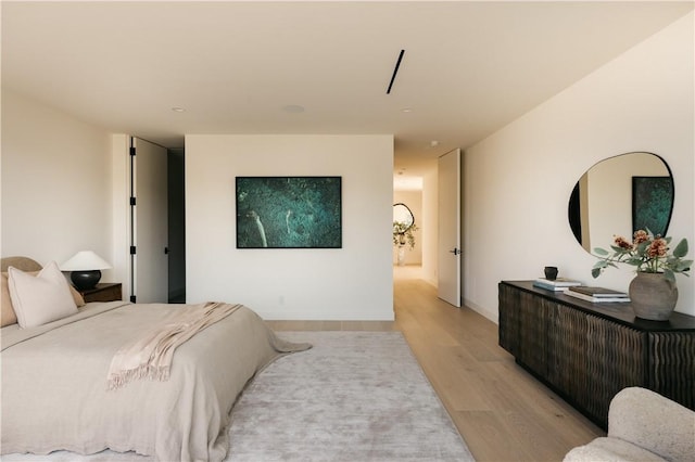 bedroom with light wood-type flooring