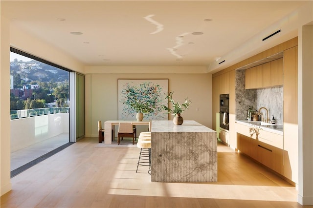 dining space featuring light hardwood / wood-style floors