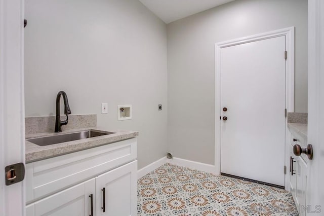 laundry area with cabinets, hookup for a washing machine, electric dryer hookup, and sink