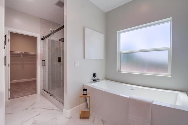 bathroom with separate shower and tub