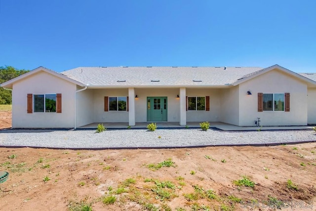 rear view of house featuring a patio