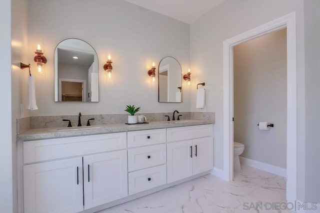 bathroom with vanity and toilet