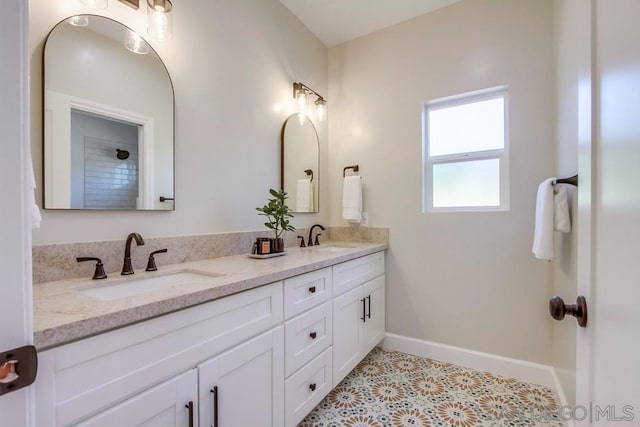 bathroom featuring tile patterned floors and vanity