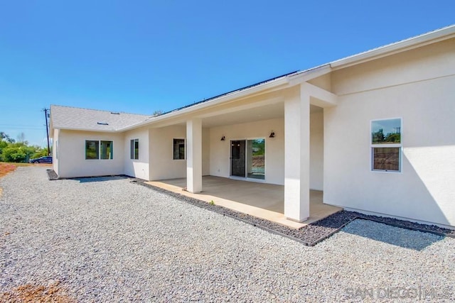 rear view of house with a patio