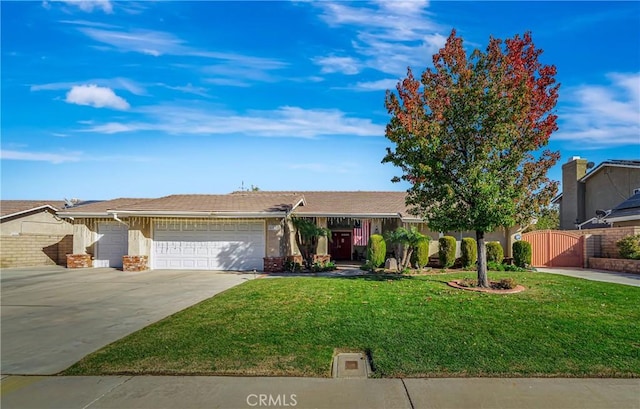 view of front of home with a front lawn and a garage